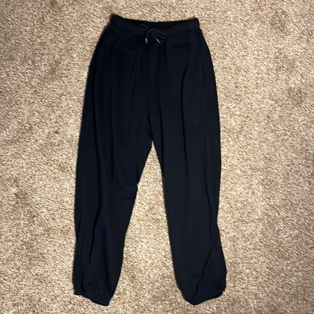 Black cuffed sweatpants.